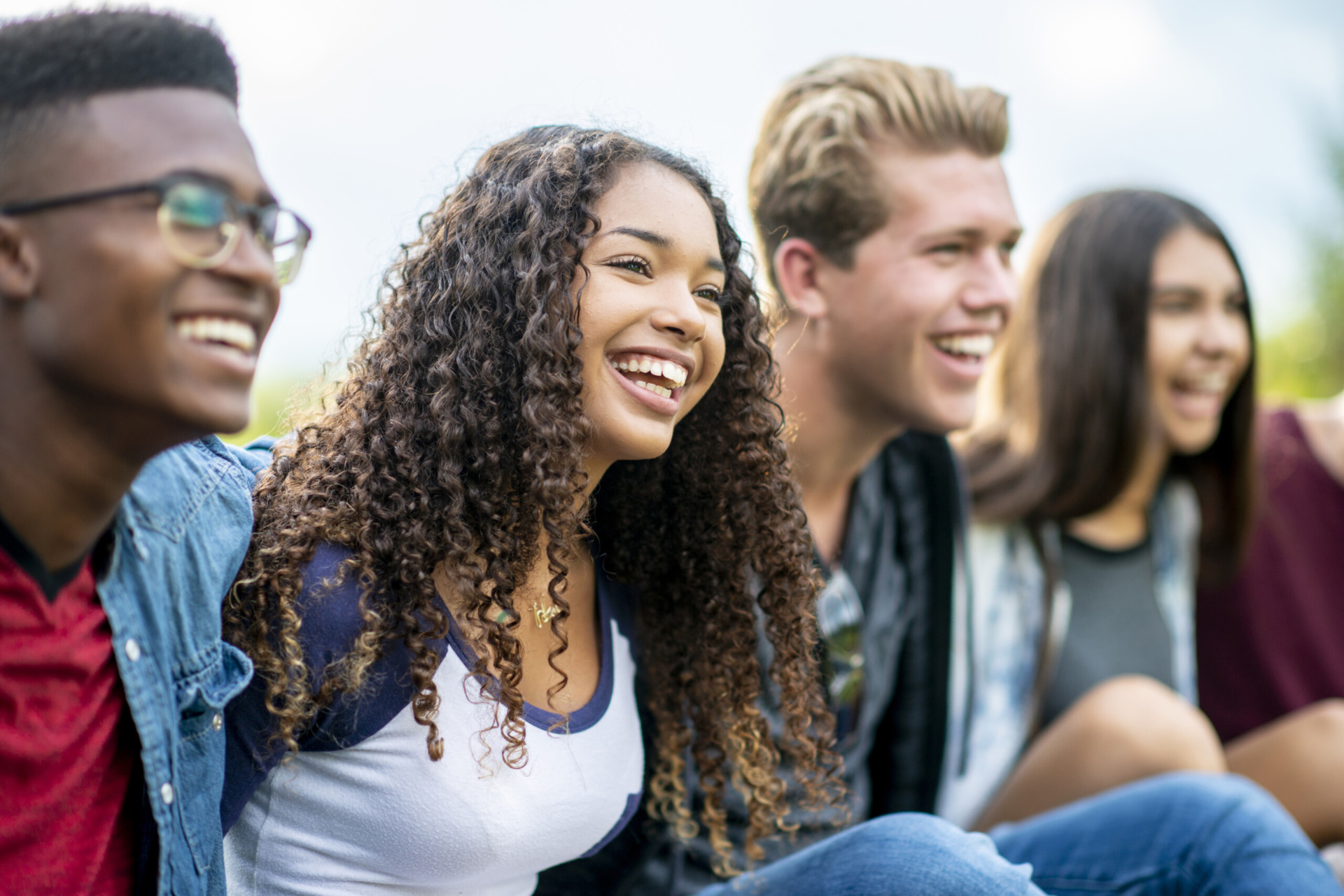 Teenage friends laughing outside