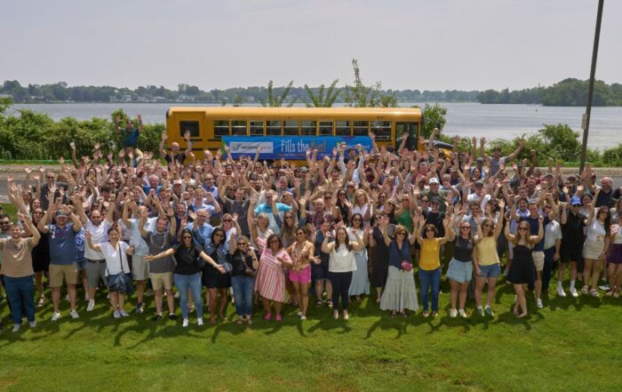 Sentinel Group Fills the Bus Team Photo