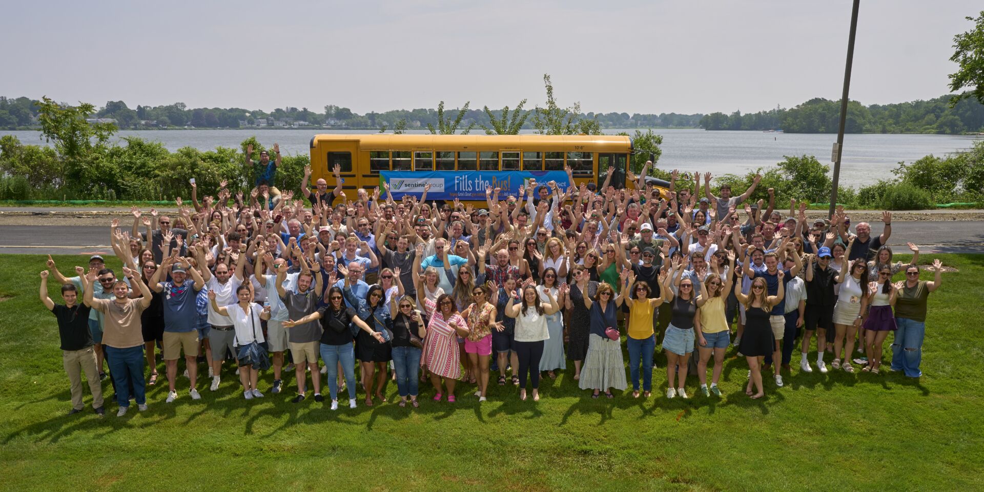 Sentinel Group Fills the Bus Team Photo